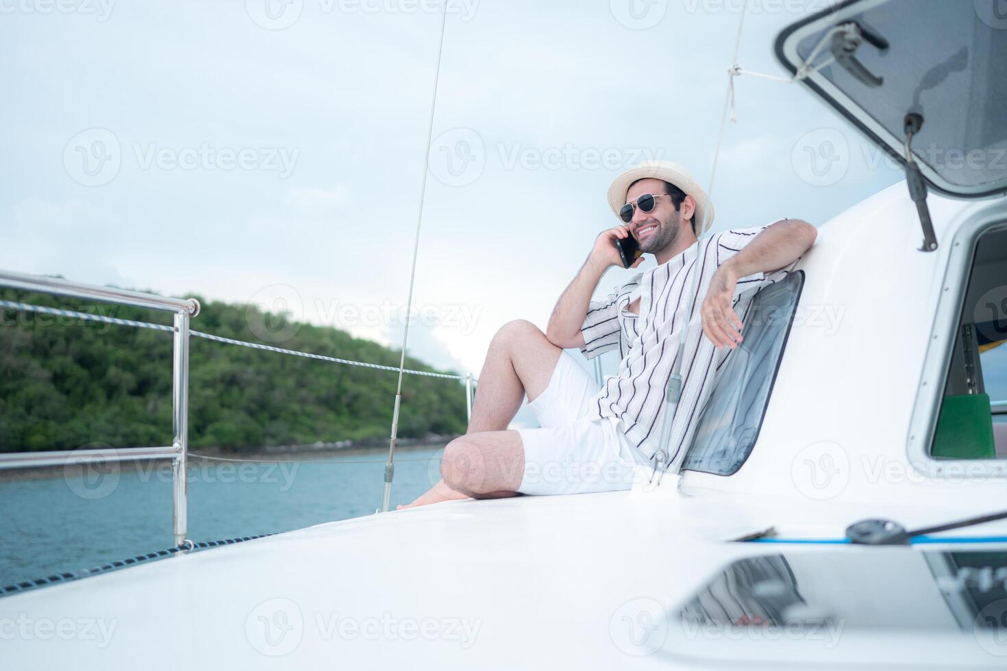 A young man is enjoying his seaside adventure aboard a yacht,89 photo