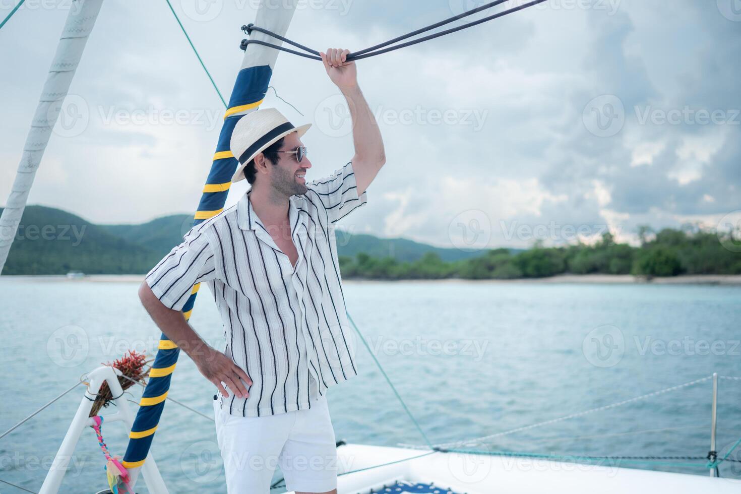 A young man is enjoying his seaside adventure aboard a yacht,69 photo