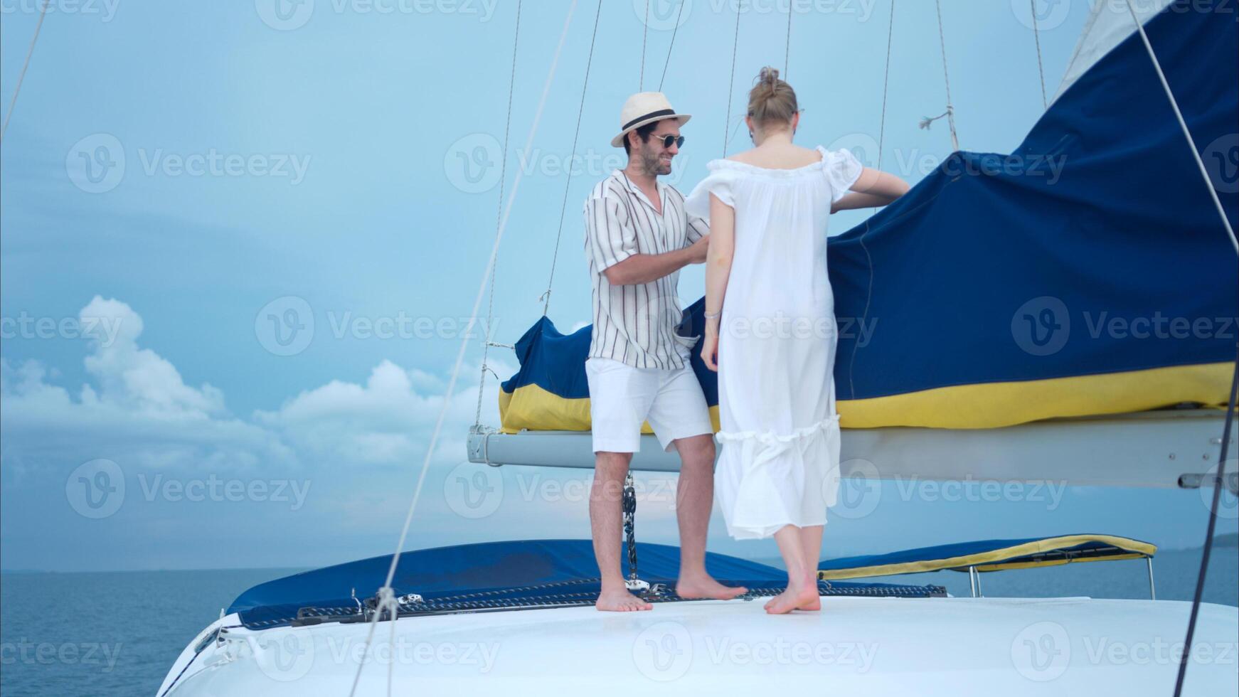 A young couple are enjoying seaside adventure aboard a yacht,48 photo