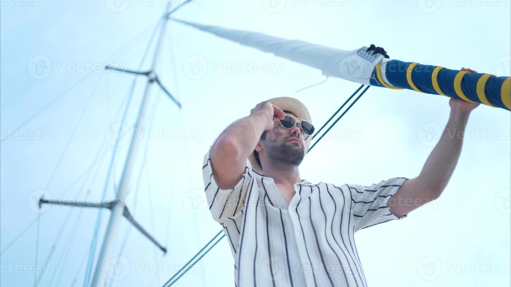 A young man is enjoying his seaside adventure aboard a yacht,39 photo