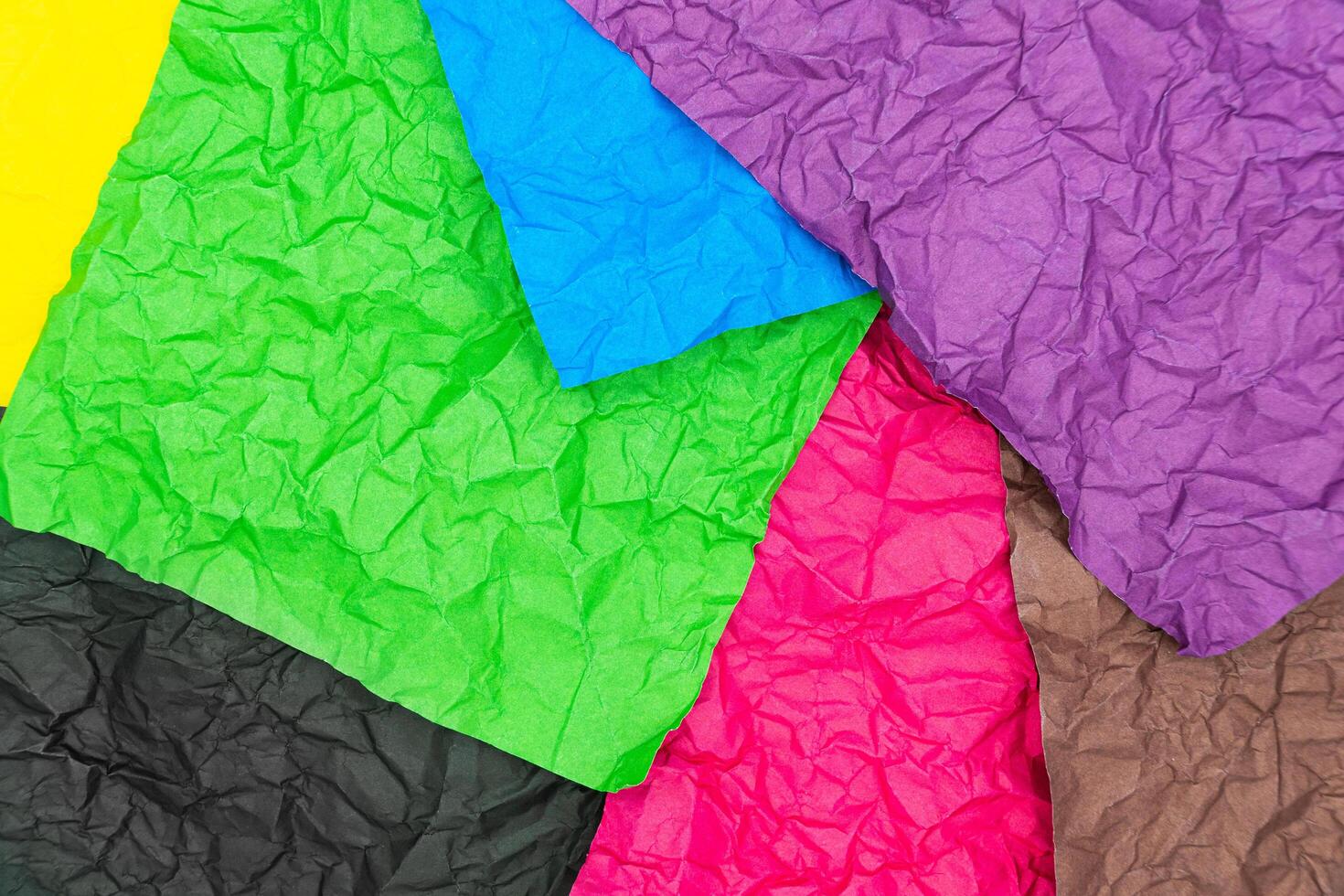 Colorful crumpled paper texture background. Wrinkled background photo