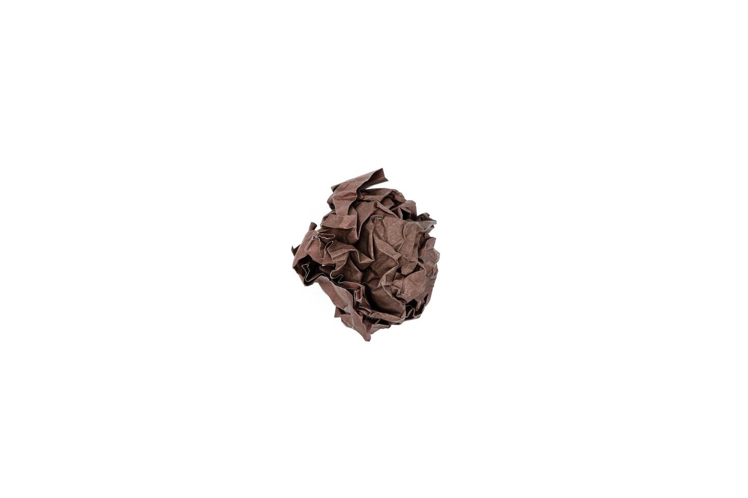 Brown crumpled paper ball isolated on white. Blank for the designer. Ideas concepts with paper crumpled ball photo