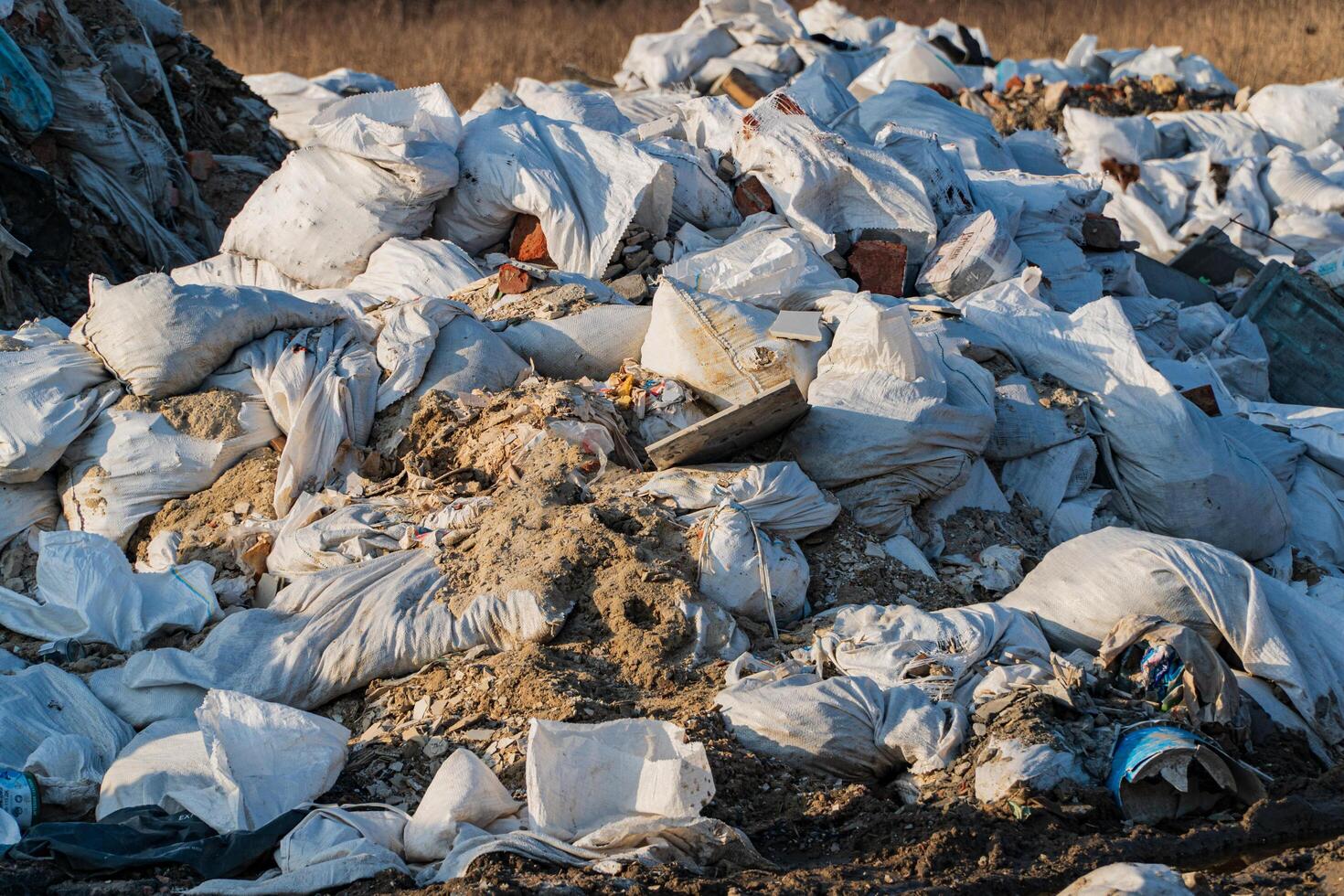 Pile of domestic garbage in landfill. Garbage bags the landfill. Pollution concept photo