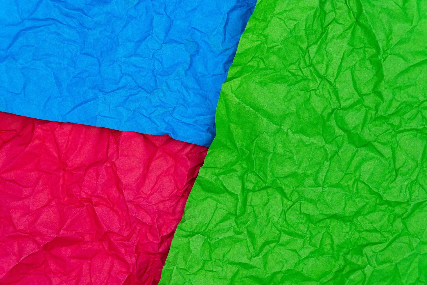 Multicolored crumpled paper texture background. Wrinkled paper surface for designs photo