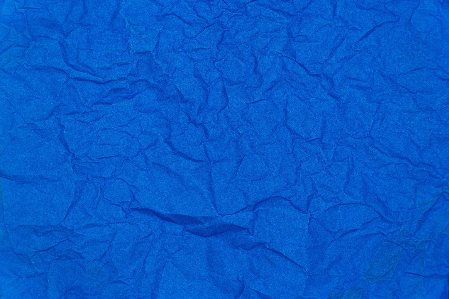 Blue crumpled paper texture background. Images for background logo text template design photo