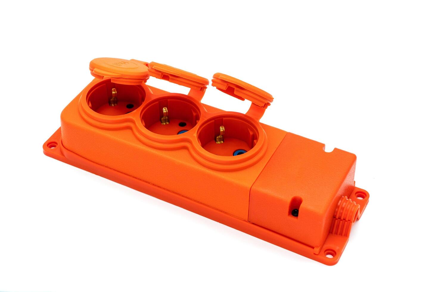 Orange power strip. Electric extender isolated on white photo