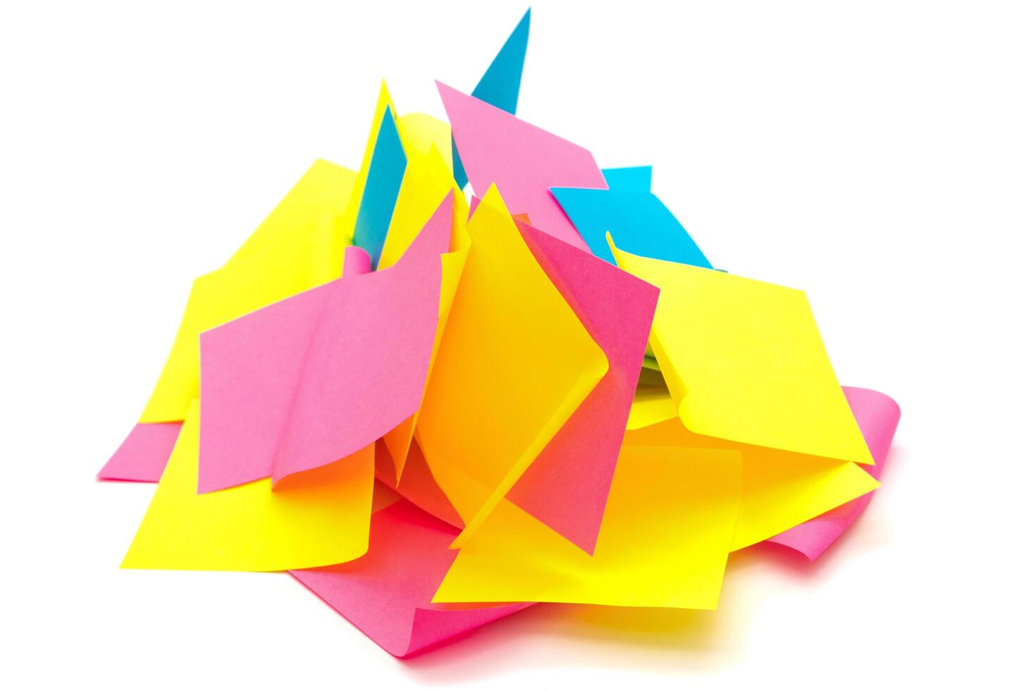 Used colorful stickers notes heap isolated on white photo