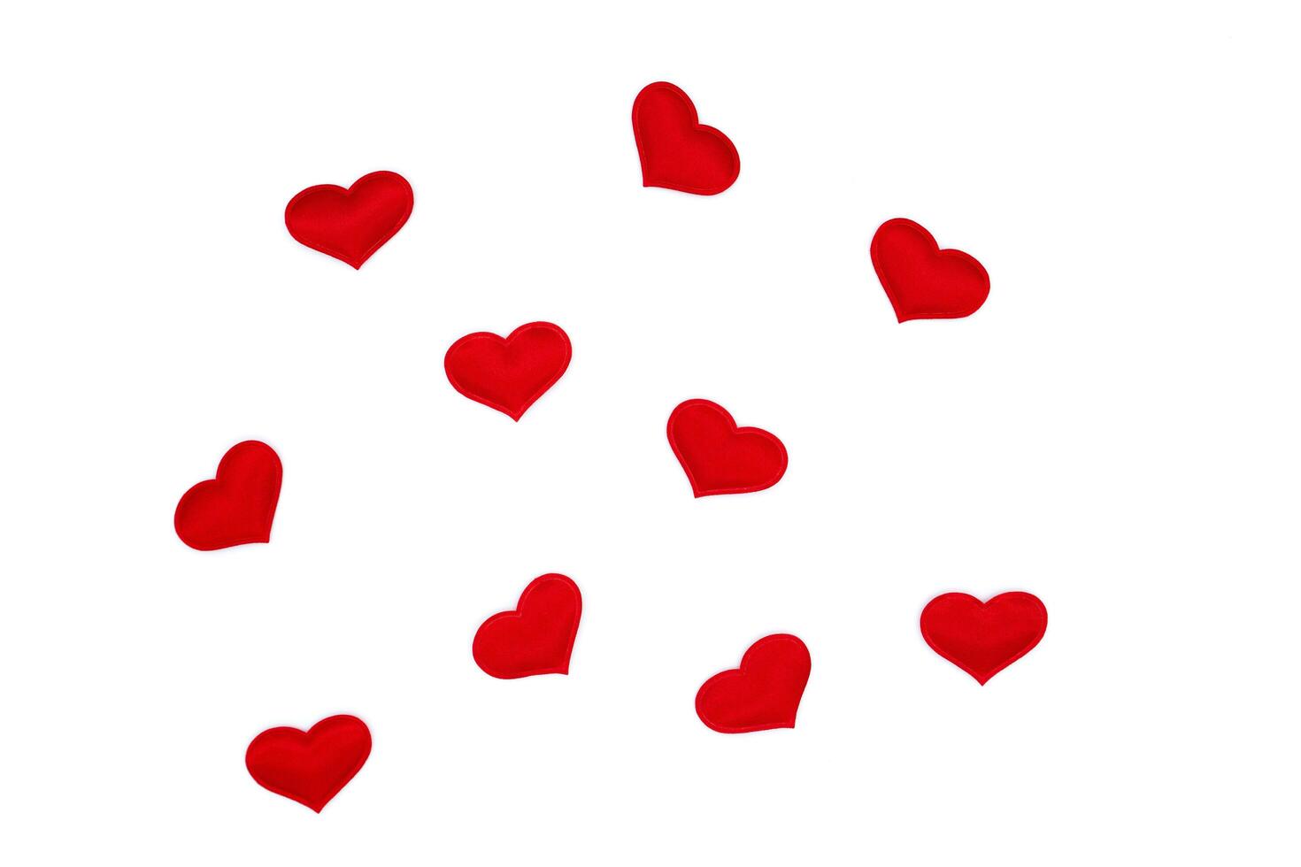 Little red hearts on a white background photo
