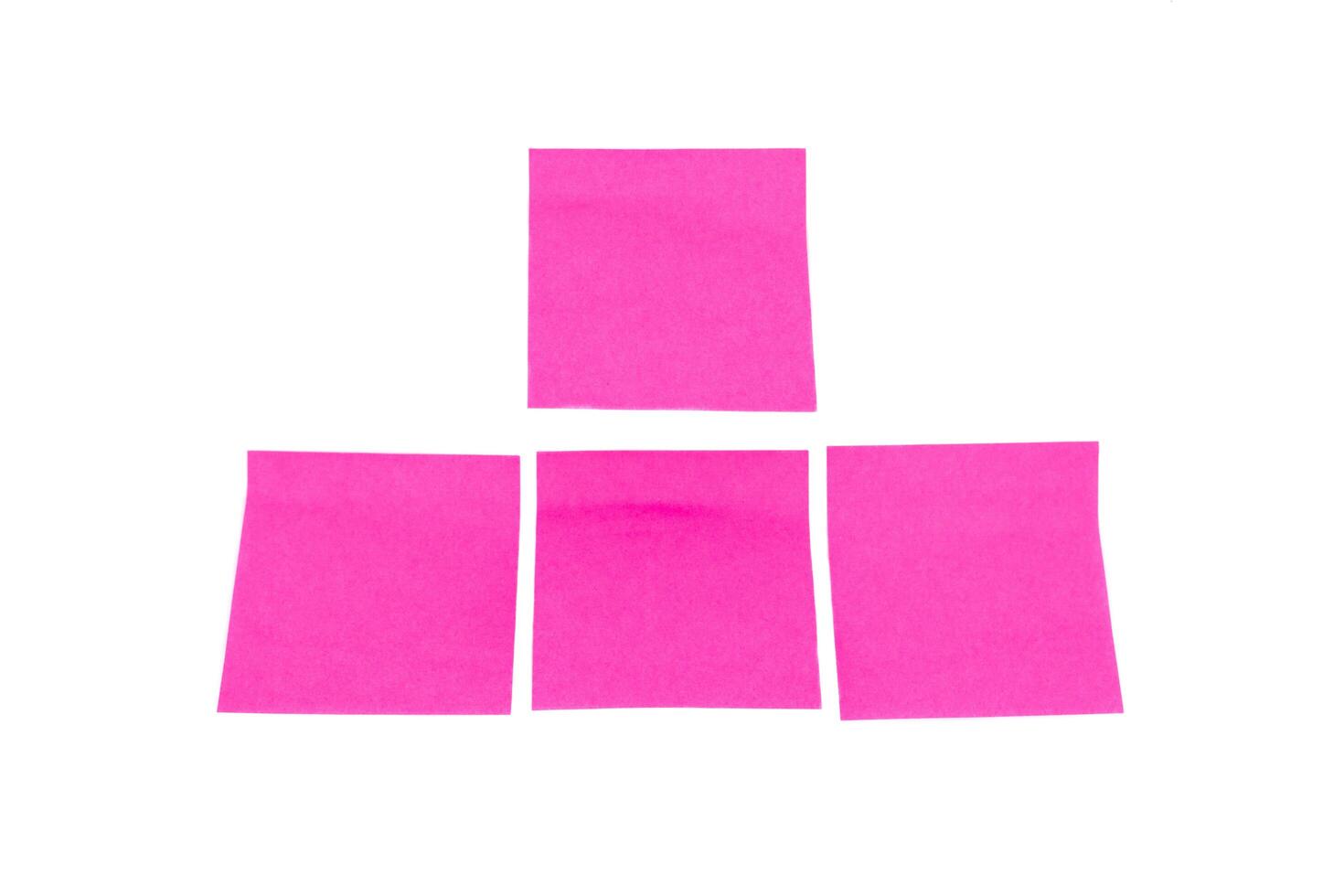 Four pink Sticky Post Note Paper Isolated on White Background photo