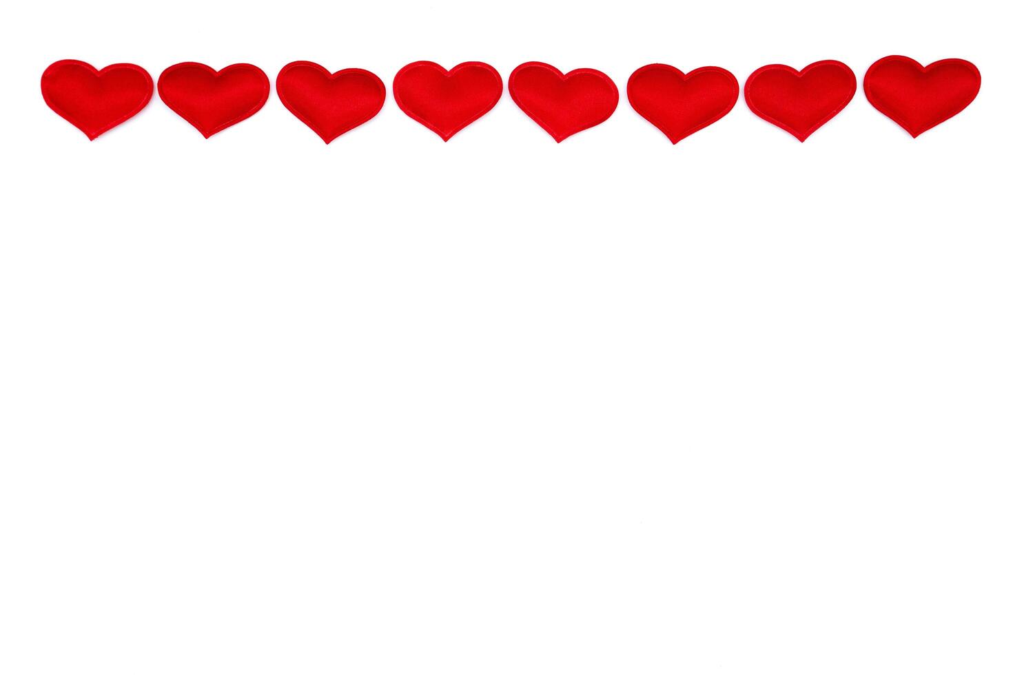 Red hearts on a white background, top view, copy space photo