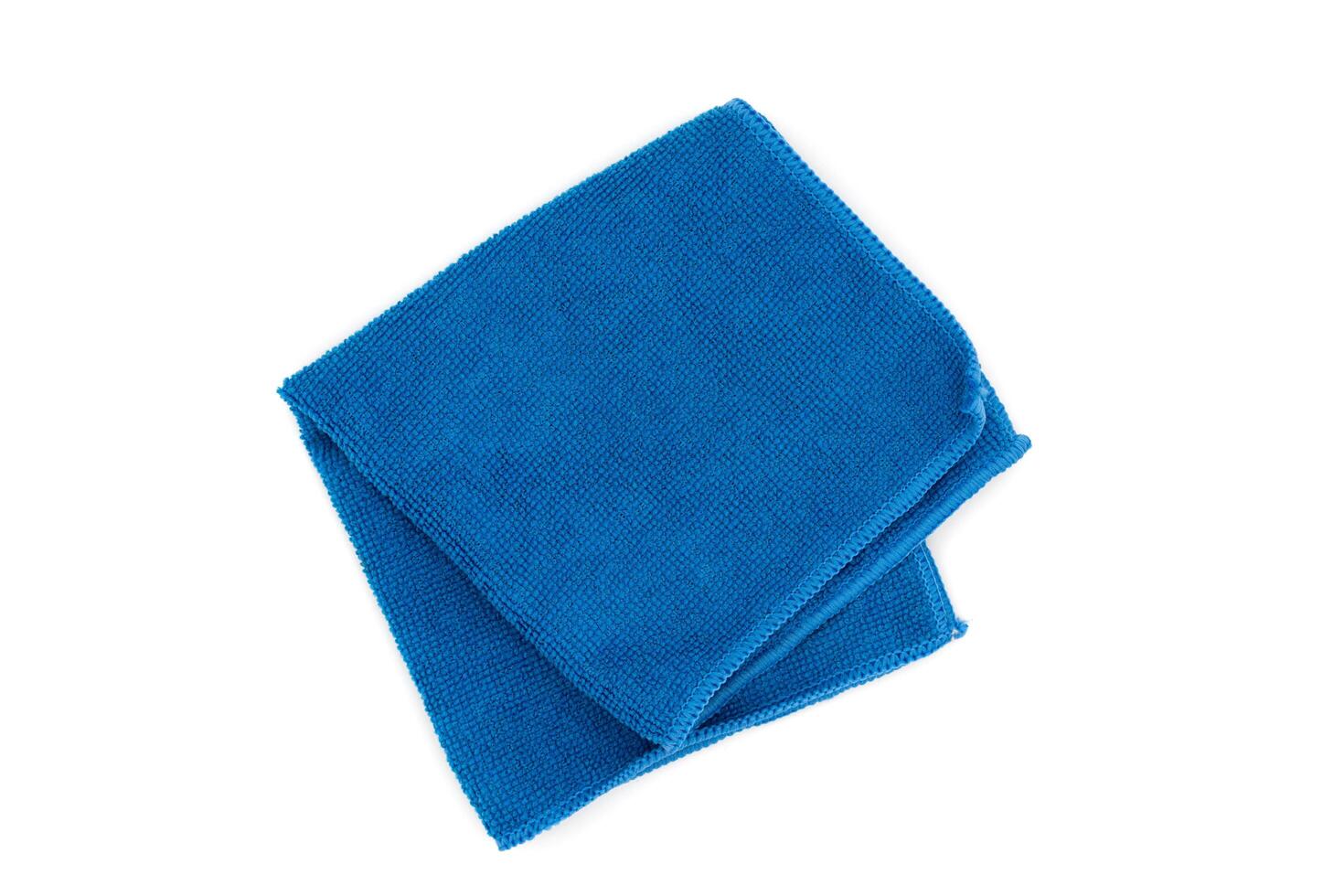 Closeup blue duster microfiber cloth for cleaning isolated on white background. Top view. Flat lay photo