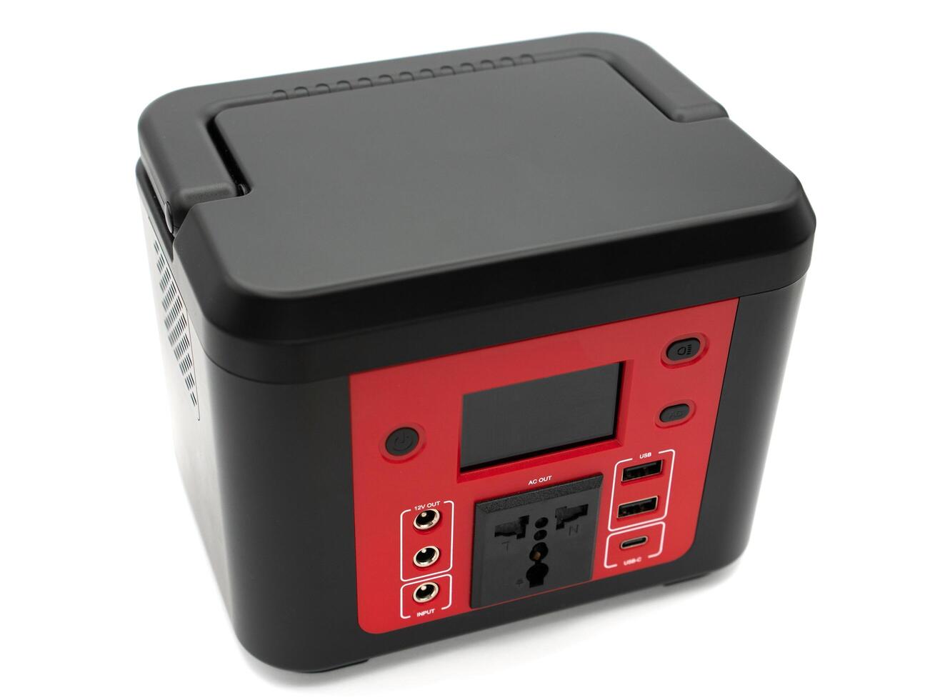 Isolated on white portable power station. Big power bank for charging devices photo