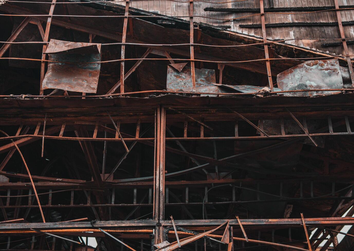 Burnt out shop after fire. The metal structure of the store after the fire photo