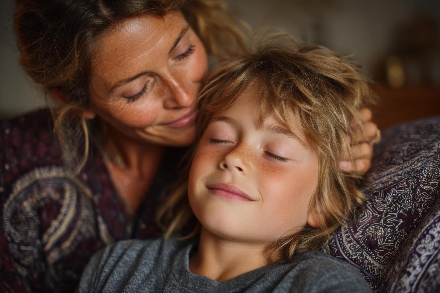 A woman and a child are hugging each other photo