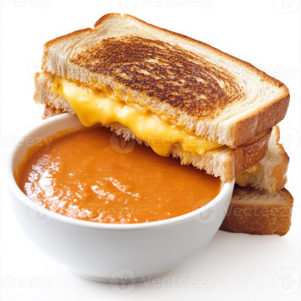 A golden-brown grilled cheese sandwich with melted cheddar oozing between two crispy slices of buttered bread. Served alongside a bowl of tomato soup for the ultimate cozy meal. Isolated on clean white background photo