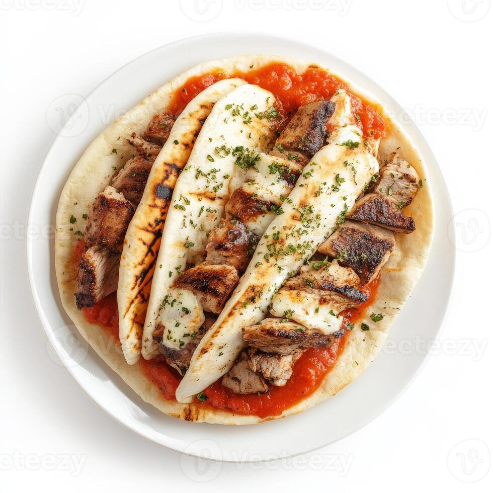 A plate of Greek gyros, transformed with the bold and savory flavors of Italian cuisine, featuring pita bread, filled with grilled chicken or beef, marinara sauce, mozzarella cheese, and a side of garlic bread, a unique and flavorful take on a Greek favor photo
