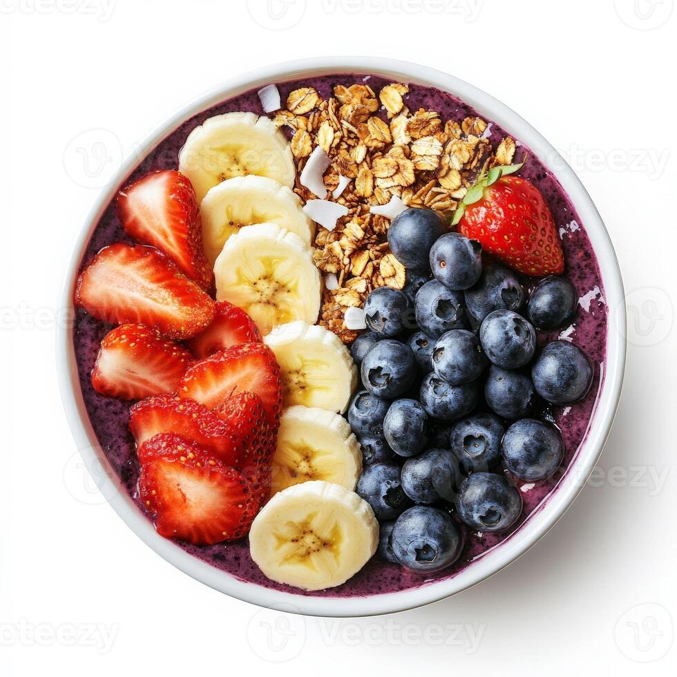 A vibrant acai bowl topped with fresh strawberries, blueberries, sliced bananas, granola, coconut flakes, and a drizzle of honey. A colorful and nutritious breakfast. Isolated on clean white background photo