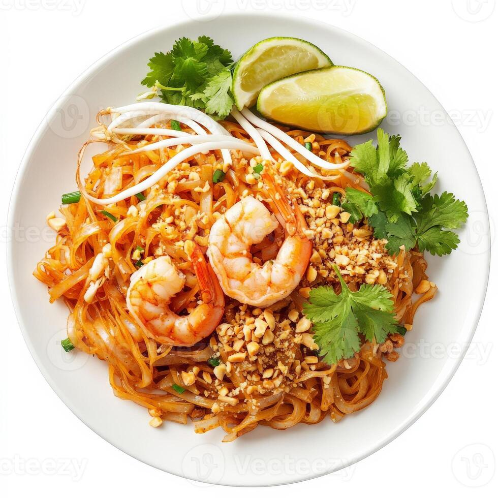 A plate of authentic Pad Thai with stir-fried rice noodles, shrimp, crushed peanuts, bean sprouts, lime wedges, and a sprinkling of fresh cilantro. A popular Thai street food dish. Isolated on clean white background photo