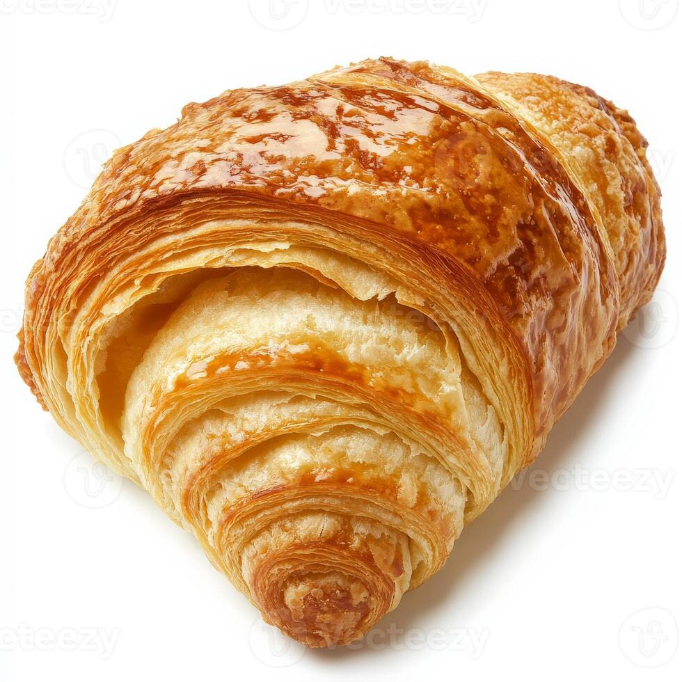 A freshly baked croissant with golden, flaky layers, its crisp exterior glistening with butter. The airy inside is slightly exposed, revealing its soft, delicate texture. Perfect for breakfast or a French-inspired snack. Isolated on clean white background photo