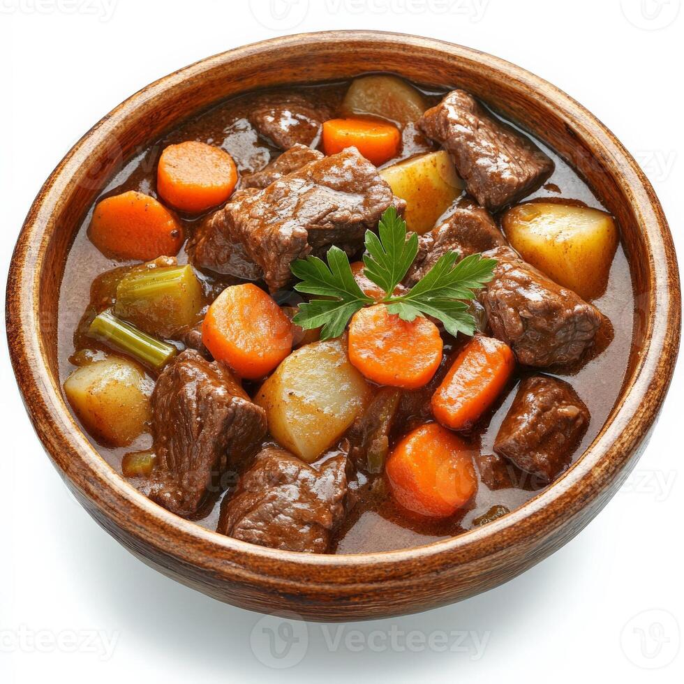 A hearty beef stew with chunks of tender slow-cooked beef, carrots, potatoes, and celery, simmered in a rich, savory broth. Served in a rustic bowl, perfect for cold-weather comfort food. Isolated on clean white background photo
