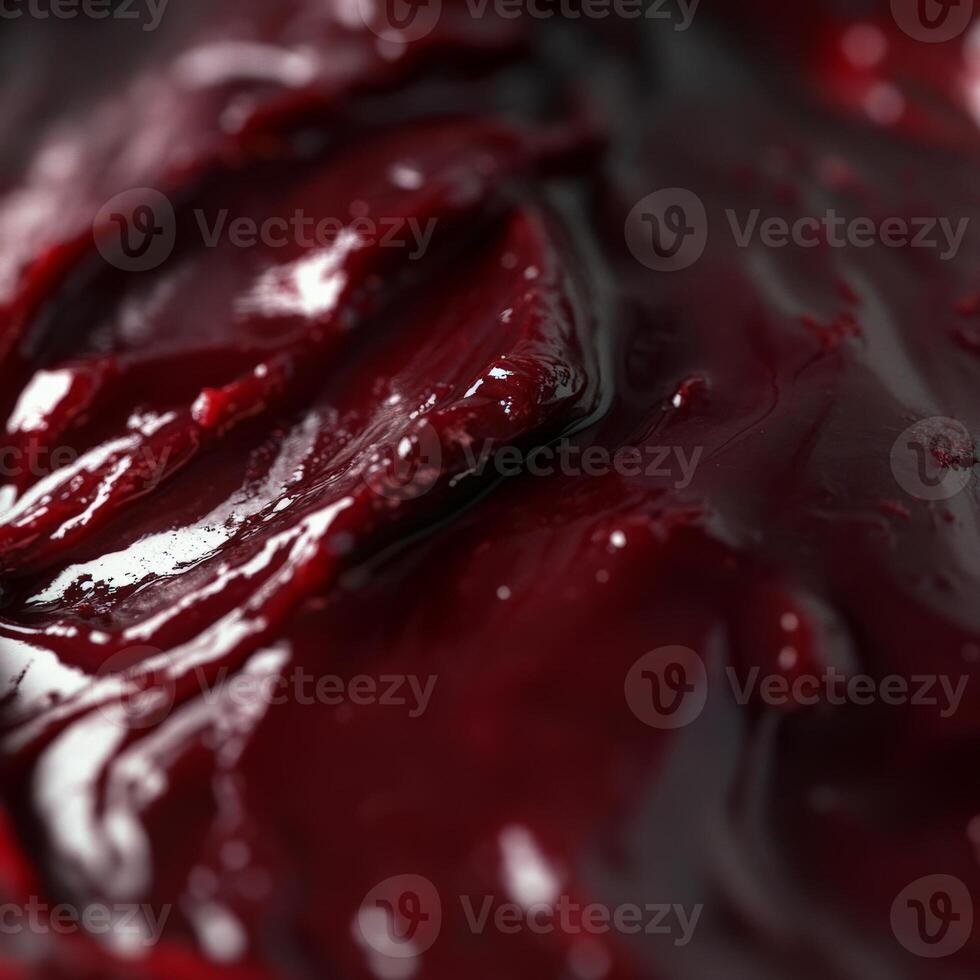 A close up of a red sauce with some liquid photo