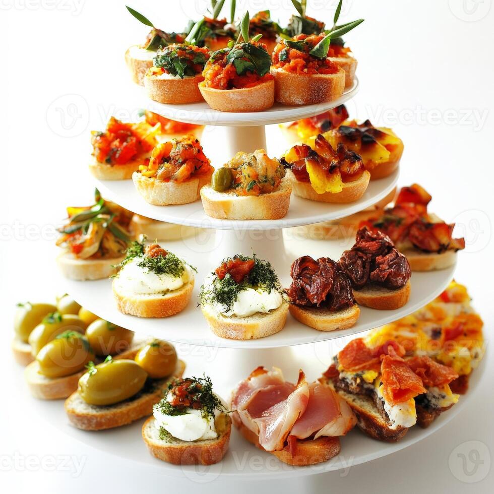 A three tiered stand with appetizers on it photo