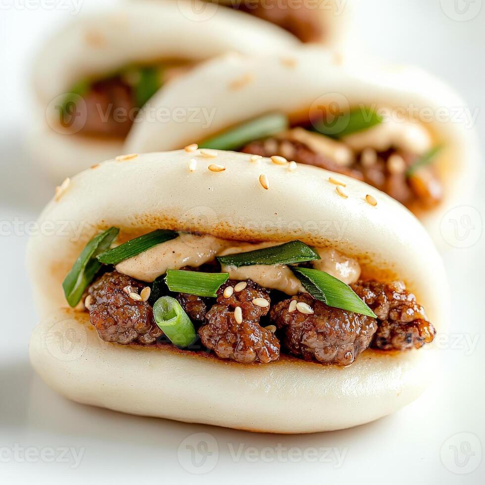 A white plate with three buns photo