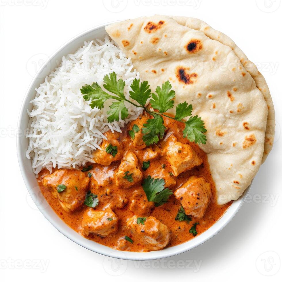Chicken tikka masala curry in a bowl with rice and cilantro photo