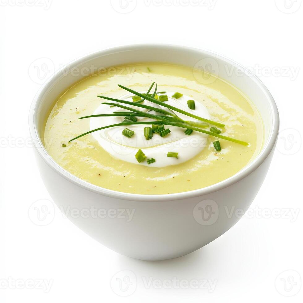 Potato soup with sour cream and chives in a white bowl isolated on white background photo
