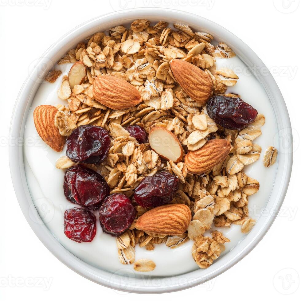 Granola with almonds and cranberries in a bowl isolated on white background photo