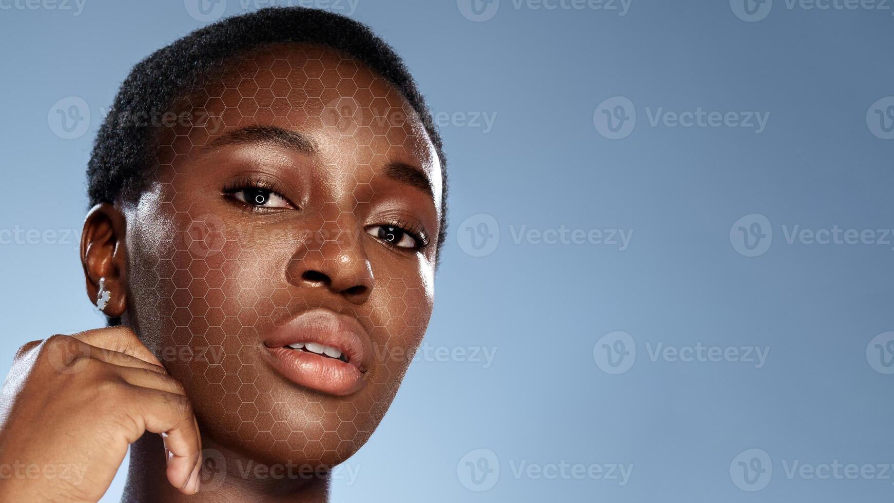 Portrait of a young woman with a creative hexagonal pattern overlay against a light blue background photo
