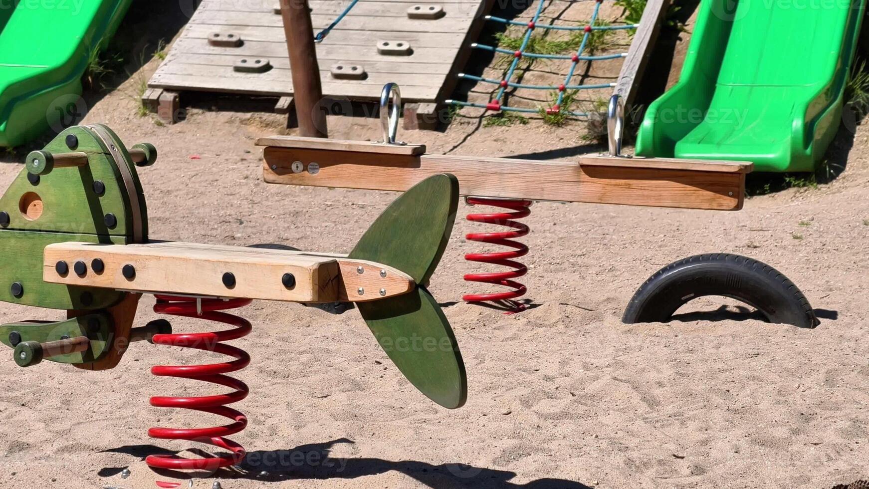 The playground is filled with colorful, engaging springbased toys for childrens endless fun and enjoyment photo