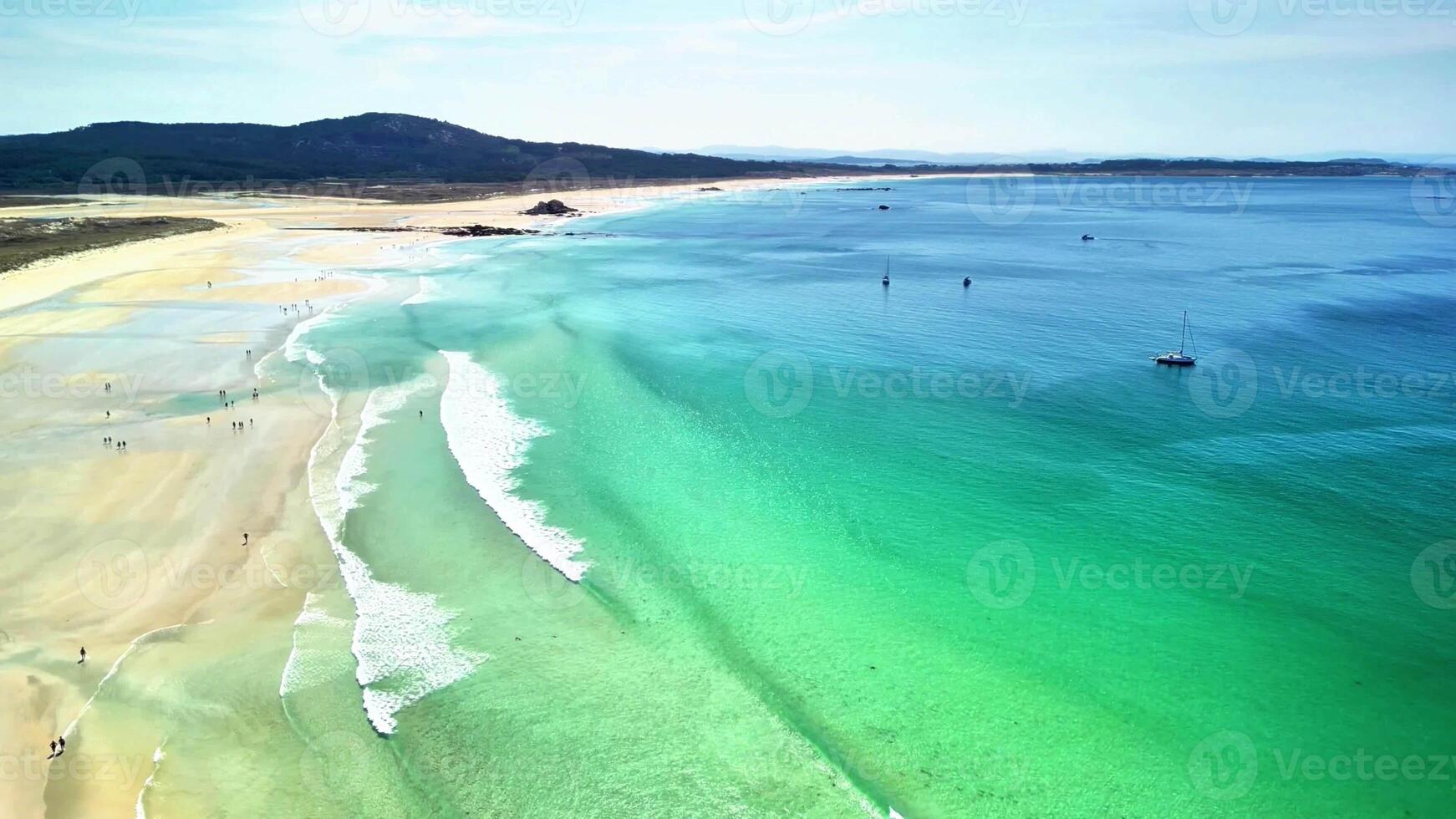 Explore this stunning beach with turquoise waters and soft sands, perfect for relaxation and adventure. photo