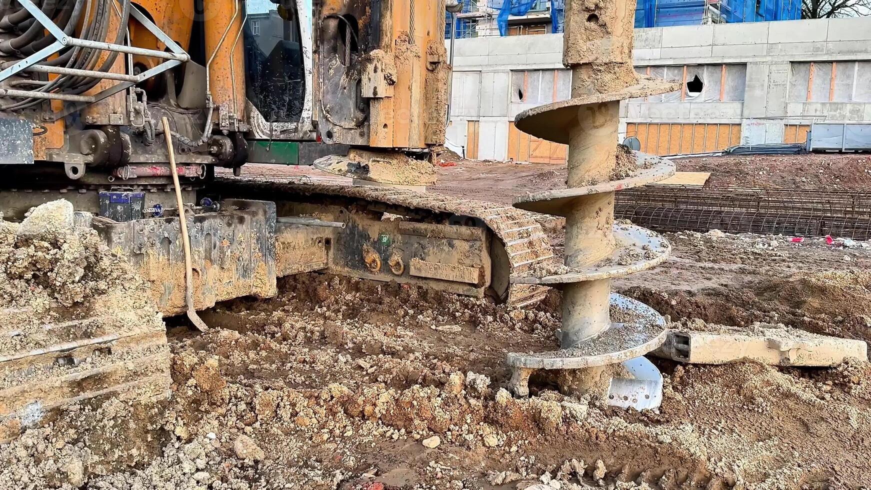 A detailed view of a powerful auger drill used for earth excavation at construction sites, showcasing its capabilities photo