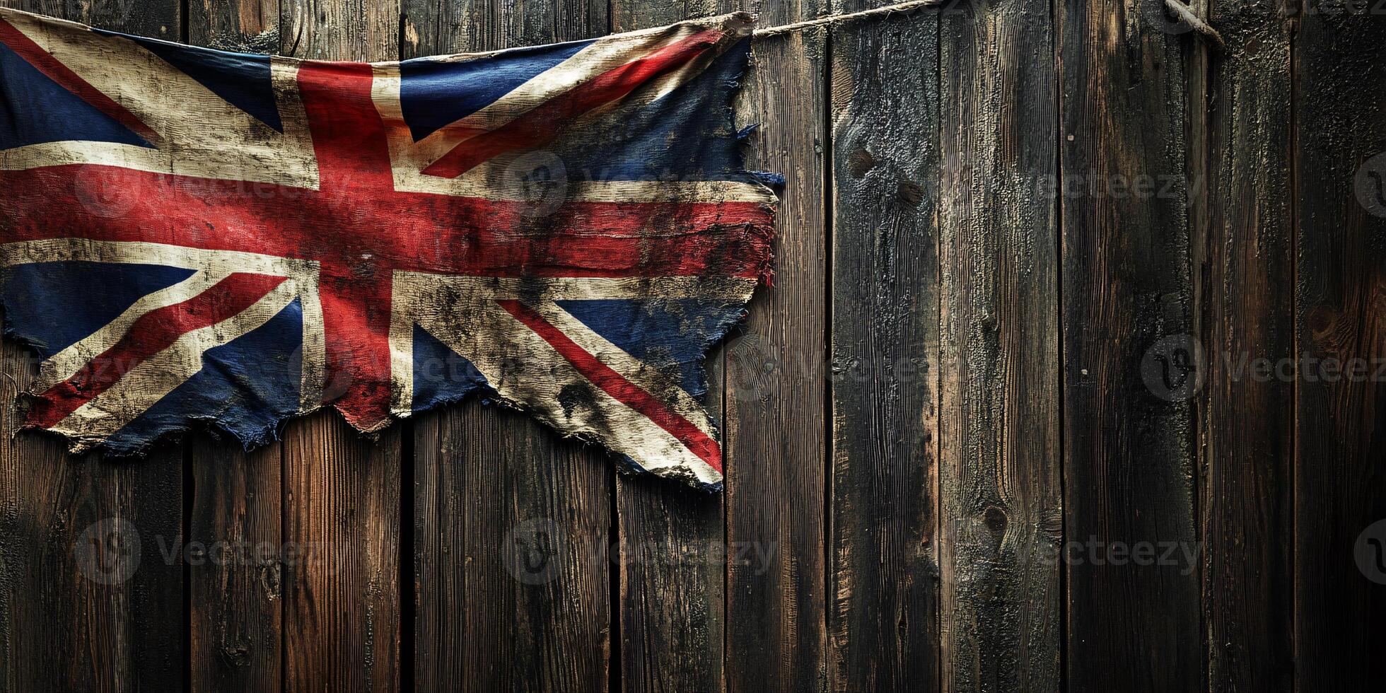 British flag gracefully draped over a rustic wooden fence showcasing patriotism photo