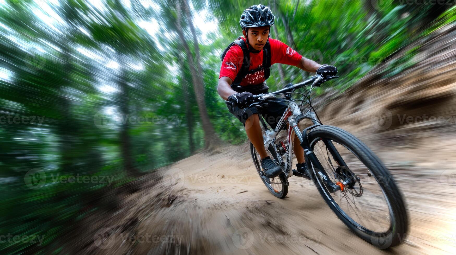 A South Asian boy skillfully navigates a dirt trail on his mountain bike, surrounded by lush greenery under bright sunlight, showcasing his adventurous spirit. photo