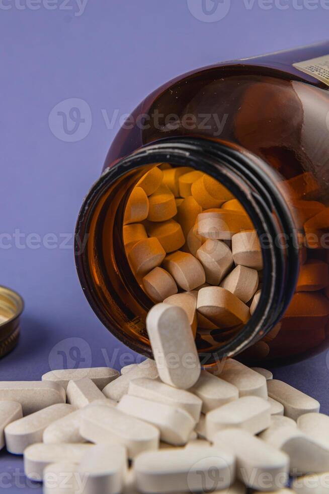 Bottled supplements spill onto a surface in clear view photo