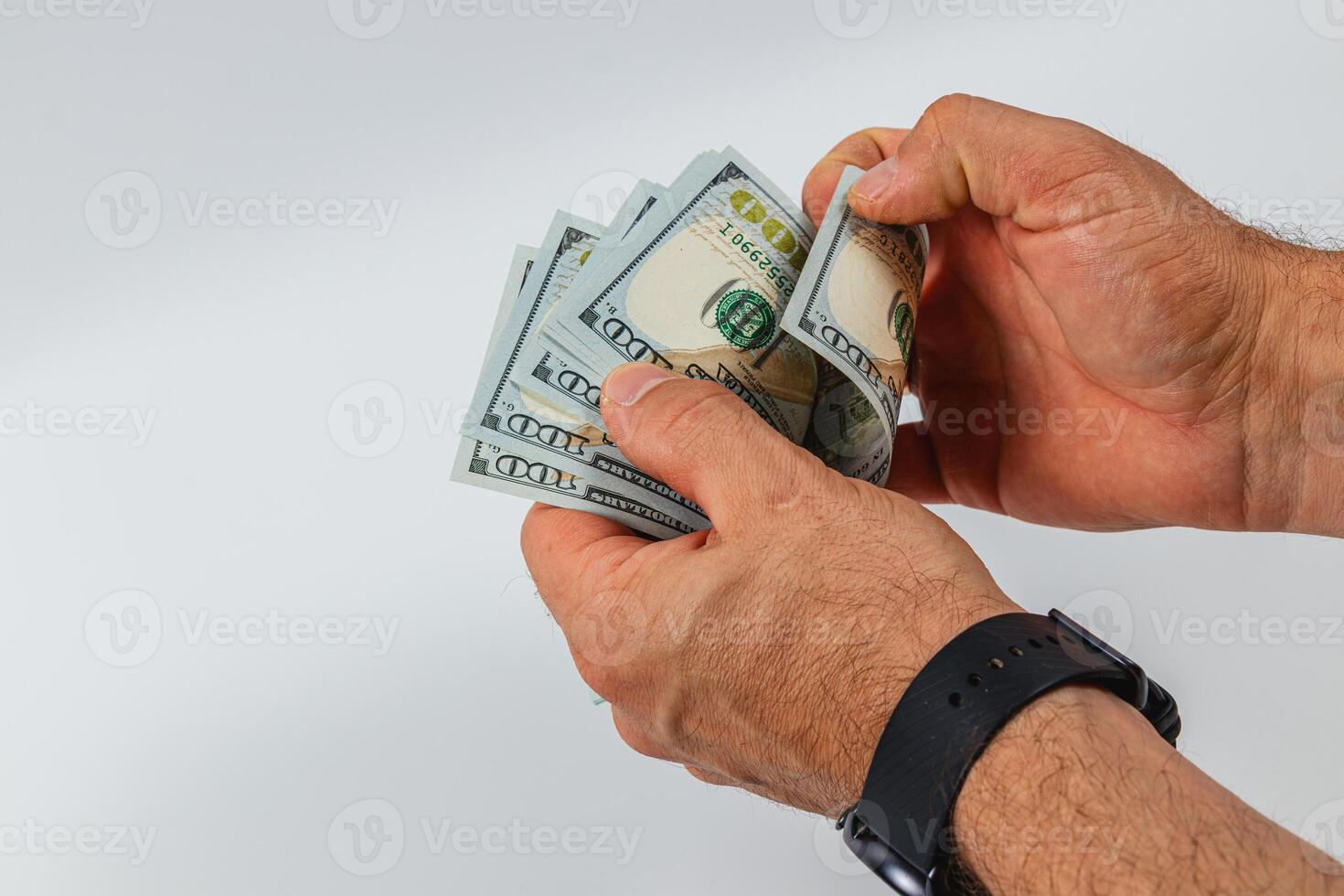 Counting cash with hundred dollar bills in hands photo