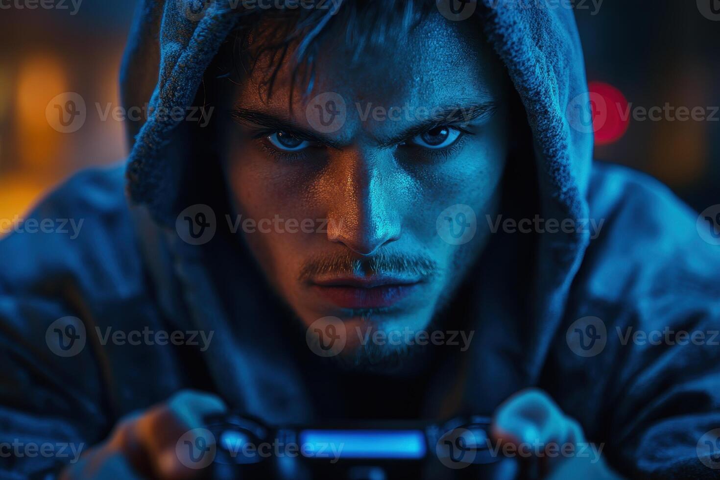 Intense gaming session at night with a focused player in a hoodie holding a controller in a dimly lit environment filled with colorful lights photo