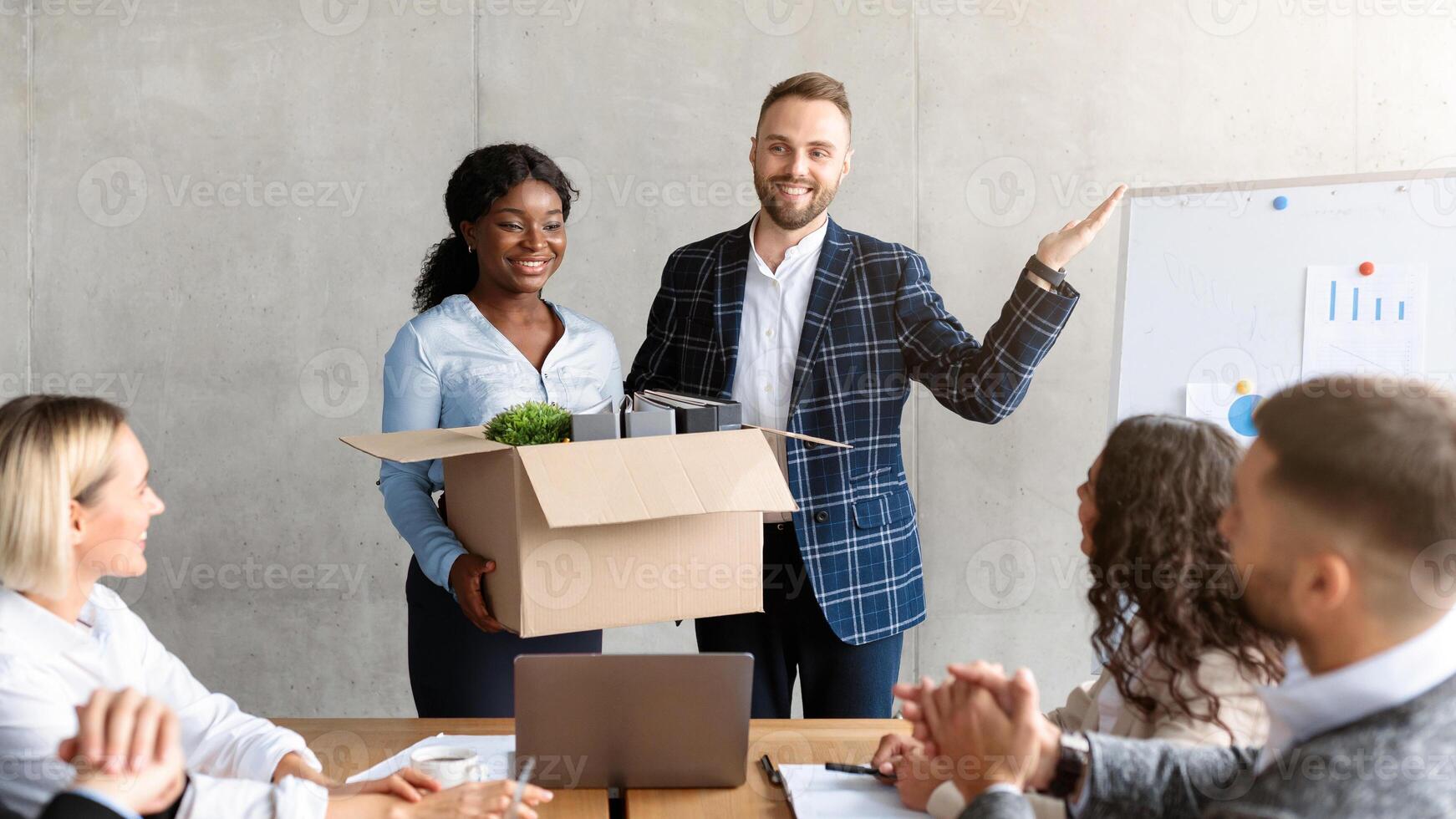 HR Manager Introducing New Female Employee To Multiracial Colleagues Team During Corporate Meeting Standing In Office. Recruitment And Employment, Business Career And New Job Concept. Selective Focus photo