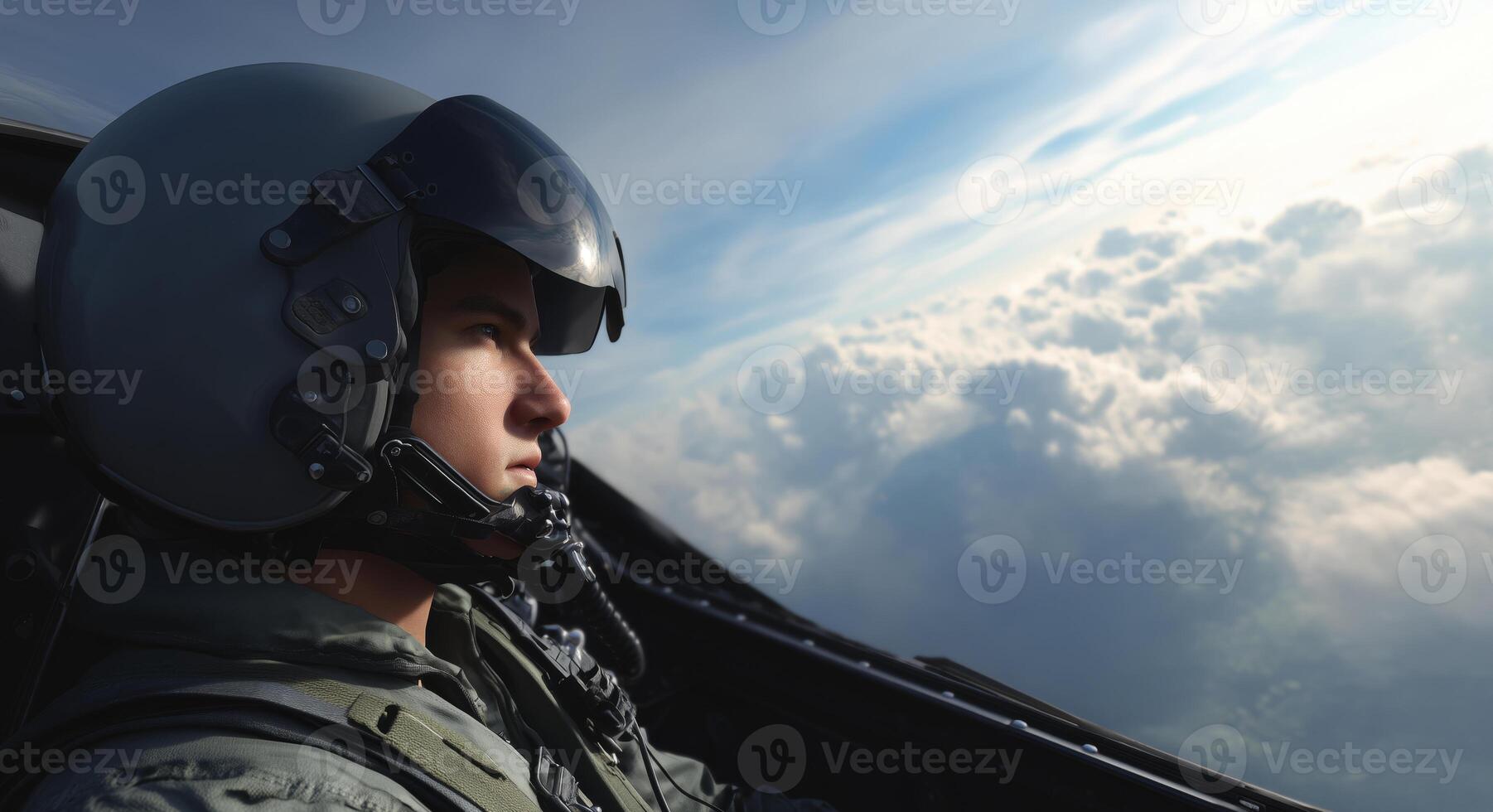 A skilled pilot focuses intently on maneuvering a fighter jet high above the clouds. photo