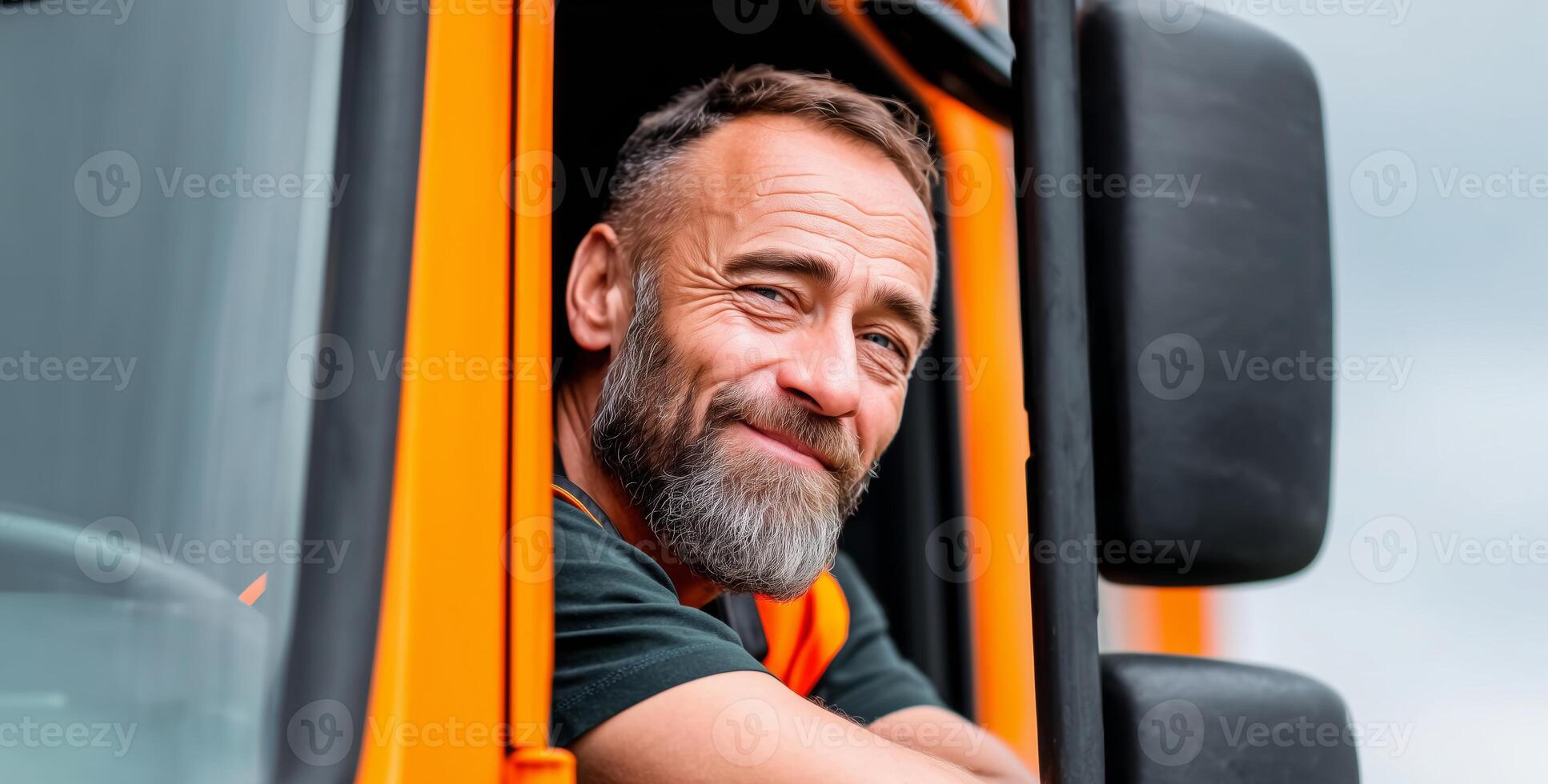 A man in a vibrant orange vest leans out of the window of his truck, smiling and embracing the day. The warm atmosphere suggests a busy day ahead in the transportation profession. photo