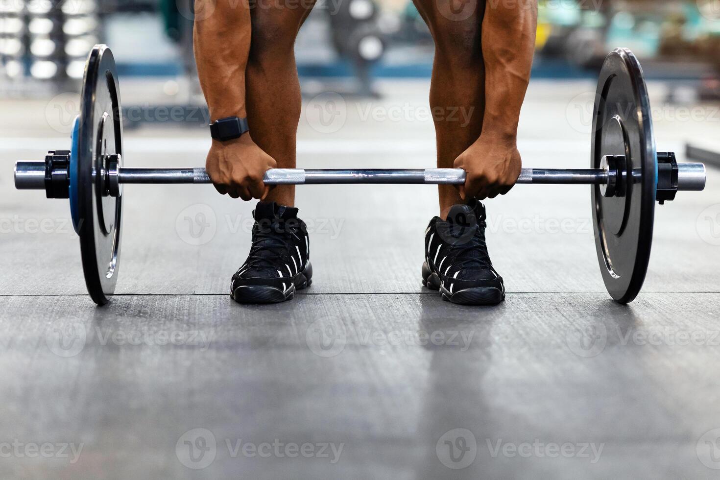 Powerlifting, bodybuilding concept. Cropped of black muscular man hands lifting weights in gym. Unrecognizable african american guy bodybuilder building up muscles with barbell, copy space photo
