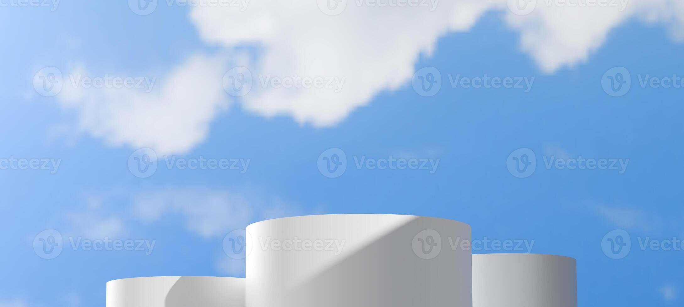 White cylindrical podiums of varying heights are set against a clear blue sky with soft clouds. Minimalist outdoor scene provides a clean and expansive backdrop, Showcasing products open air themes. photo