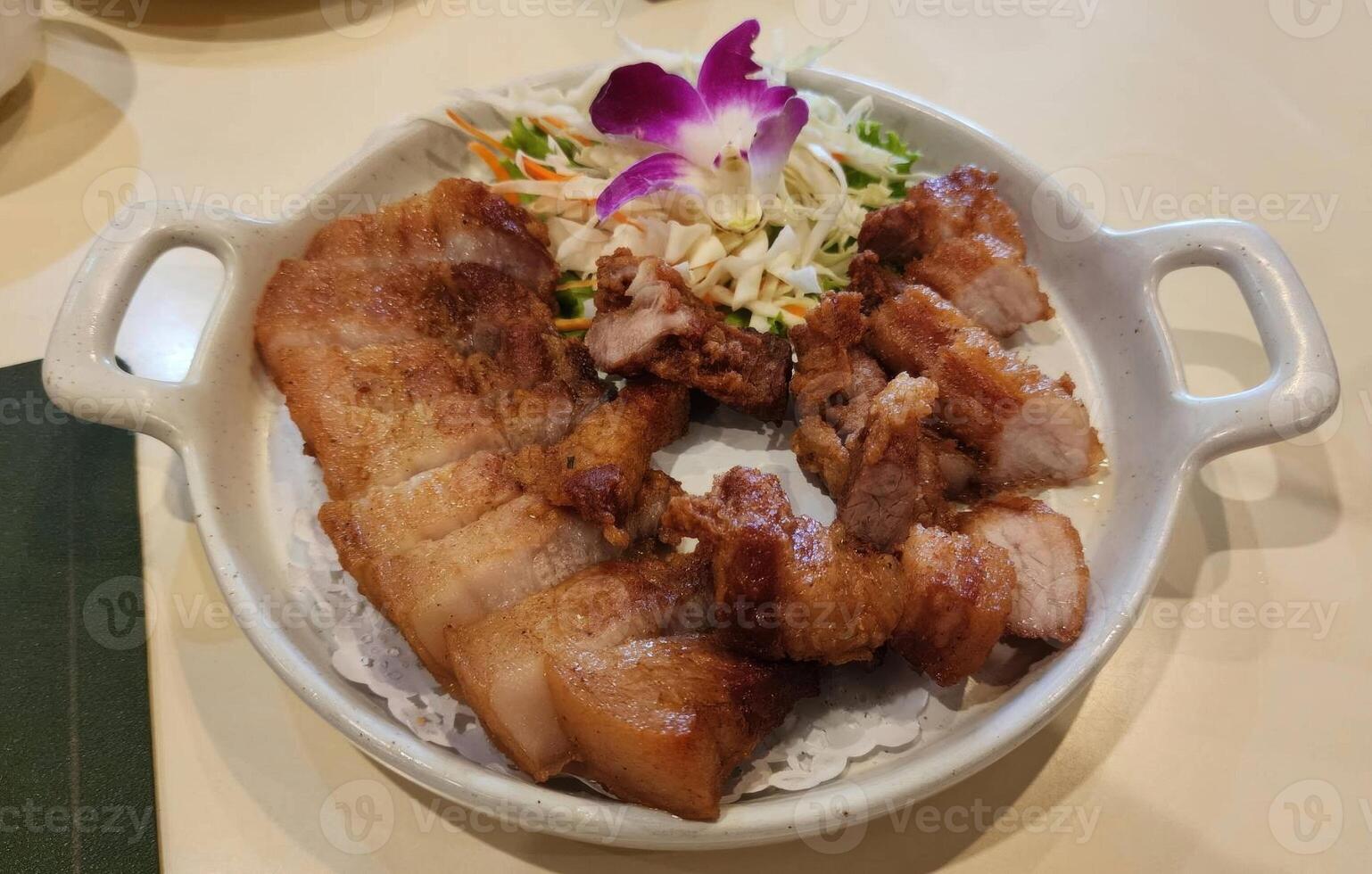 Delicious Grilled Meat Plate with Fresh Vegetables and Garnish photo