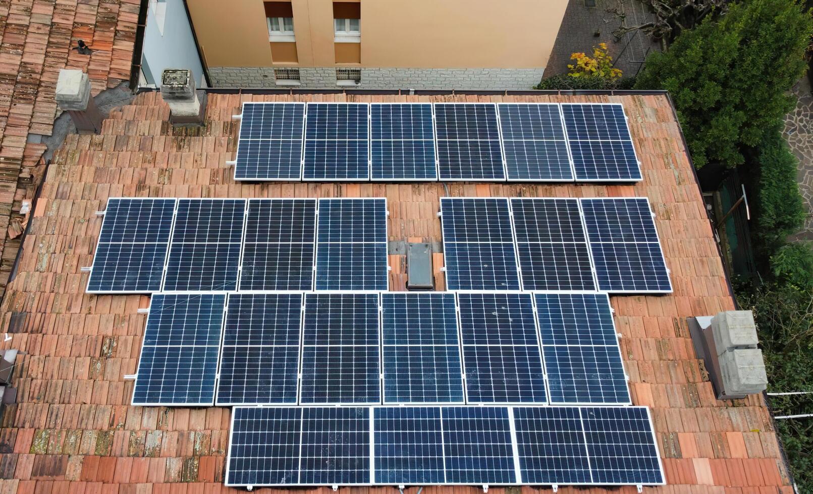 View of solar panels modules on roof. Alternative energy concept. photo