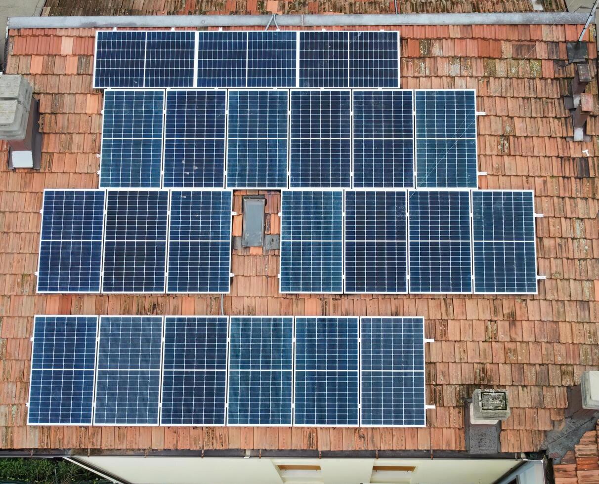 Aerial view of solar panels modules on roof. Alternative energy photo