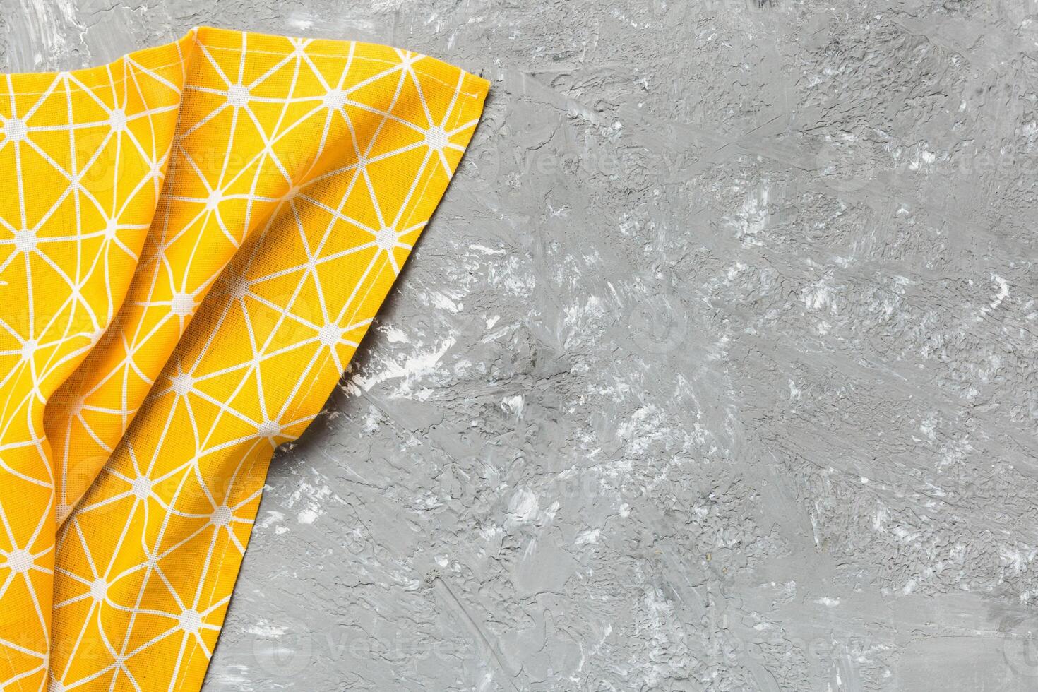 top view with yellow empty kitchen napkin isolated on table background photo