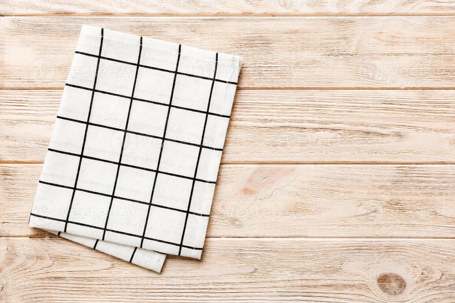 top view empty kitchen napkin isolated on table background. Folded cloth photo