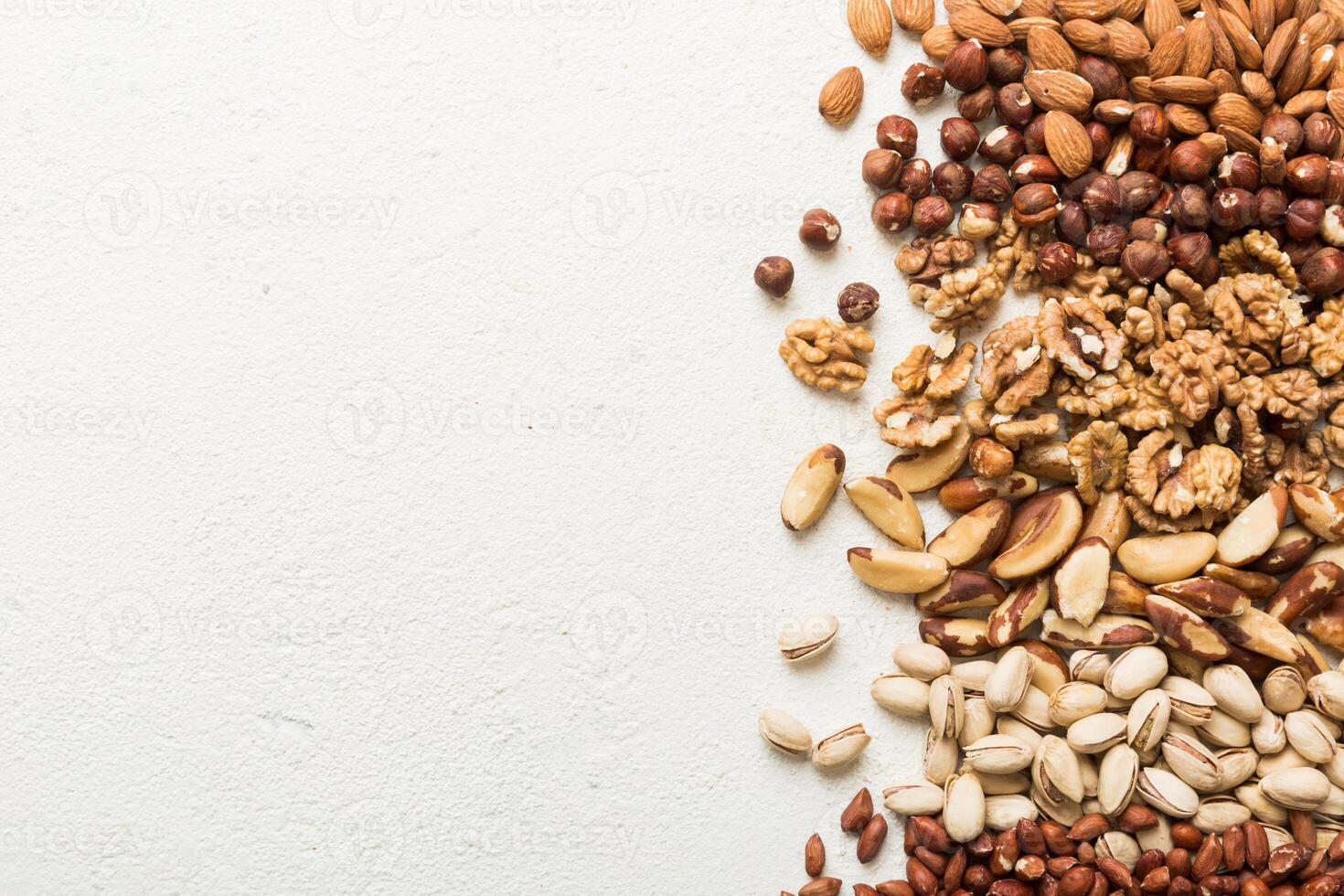 different nuts frame background. flat lay with vopy space. Walnut, almonds photo